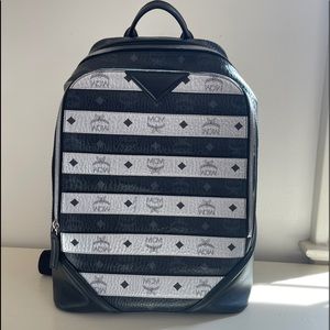 MCM Unisex Backpack w/Signature logo printed coated canvas.Adjustable back strap